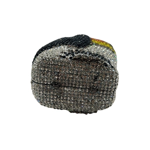 Detailed close-up of a penguin-shaped evening clutch bag with luxury rhinestones