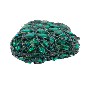 Luxury heart-shaped clutch bag encrusted with emerald green crystals and leaf textures