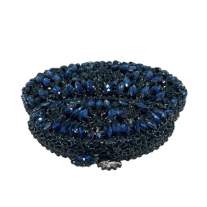 Elegant navy blue crystal clutch bag with silver floral clasp for formal evening galas