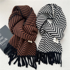 Winter knit scarf with wave patterns and fringe tassels in black, brown and white