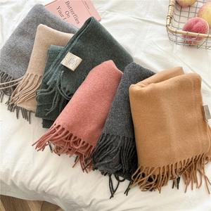 Tassel wool scarf in multiple colors like grey and beige with soft knit texture