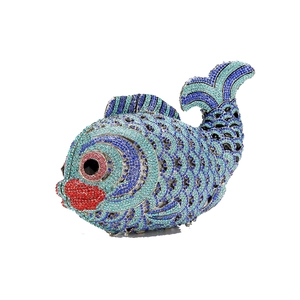 Macro detail of goldfish evening bag featuring hand-set blue crystals and rhinestones