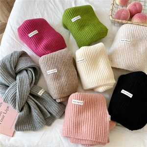 Heavy knit winter scarf in multiple colors featuring a warm wool-like texture