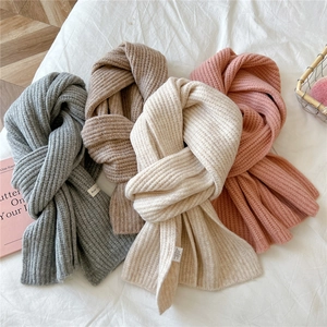 Winter knitted scarves in grey, brown, beige and pink with thick ribbed texture details