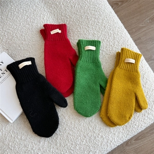 Thick knitted 100% wool mittens in black, red, green, and yellow for winter warmth