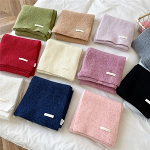 Soft ribbed knit scarves in assorted colors for winter warmth and versatile styling