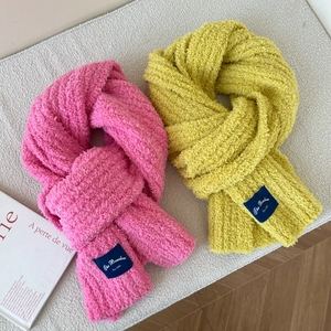 Thick plush winter scarf in pink and yellow colors with soft warmth-keeping texture