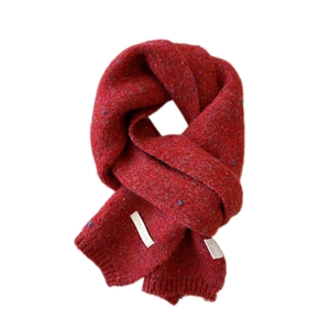 Thick red knitted long scarf with colorful speckles and ribbed ends for winter warmth
