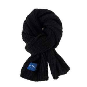 Classic black knitted winter scarf with soft thick texture and woven logo tag