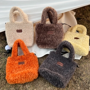 Plush faux fur tote bags in assorted colors with magnetic closure and crossbody strap
