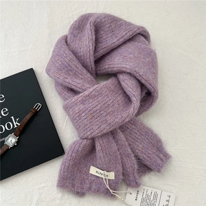 Detail of taro purple knit alpaca wool scarf showing thick texture and ALPACA material label
