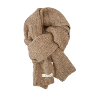 Knitted alpaca wool scarf in camel brown with soft plush texture and material label