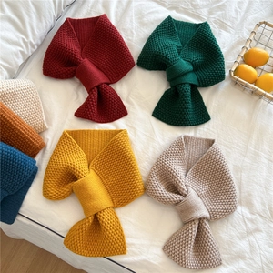Chunky knit crisscross scarf for women in multiple solid colors with waffle texture