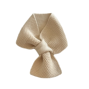 Solid cream knitted waffle scarf with crossover bow closure for warm winter neck protection