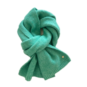 Mint green knitted winter scarf for women with ribbed ends and a gold logo detail