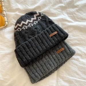 Thick knitted winter beanies in gray with warm ear protection and leather logo tags