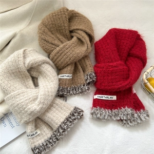 Winter knitted scarf in beige red and brown with faux fur trim and brand label