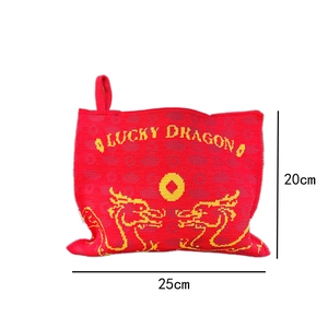 Detail of red knit dragon tissue pouch with Lucky Dragon text and yellow patterns