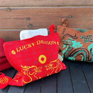 Knitted dragon tissue box covers in red and brown with Lucky Dragon pattern