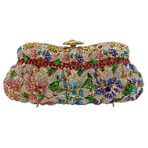 Detailed close-up of mermaid luxury clutch with colorful floral crystals and gold metal frame
