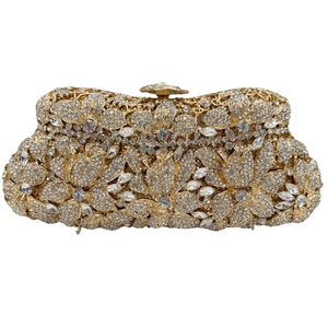 Macro detail of mermaid flower clutch bag featuring sparkling crystals and gold metal frame