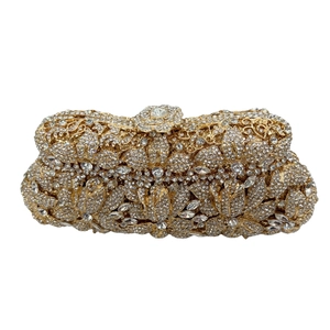 Detailed view of handmade mermaid stone clutch with 3D crystal floral patterns and crystals