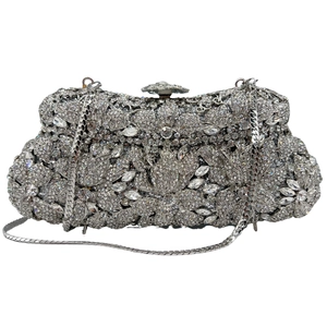 Detailed view of handmade silver rhinestone petals on luxurious metal evening clutch