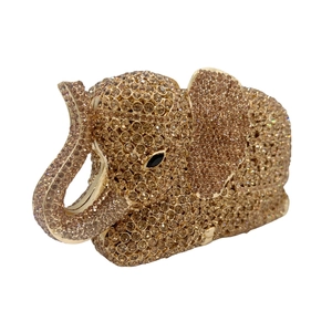 Detail view of champagne gold elephant clutch bag with sparkling crystal embellishments