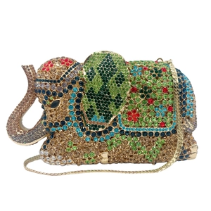 Detailed close-up of hollow elephant evening bag with colorful crystals and gold chain