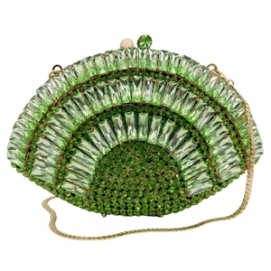 Close-up of green crystal evening clutch with gold snake chain and spherical clasp detail