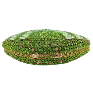 Macro view of green crystal evening clutch bag with emerald rhinestones and gold frame