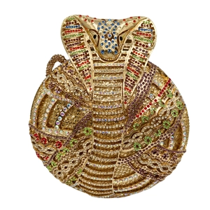 Detailed close-up of a luxury Egyptian cobra clutch bag encrusted with colorful rhinestones