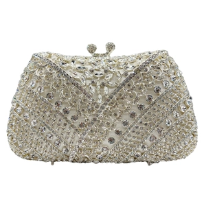 Detailed view of luxury silver crystal clutch bag with intricate rhinestone patterns