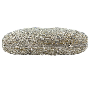 Luxury silver crystal clutch bag with elegant wavy rhinestone pattern and metal frame