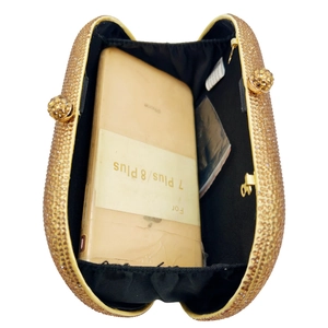 Champagne gold crystal clutch bag with rhinestones showing spacious phone storage