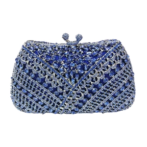Close-up of sparkling blue crystal rhinestones on a luxury evening clutch bag