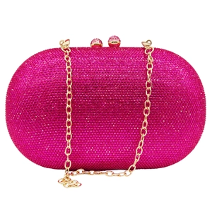 Detail of rose pink rhinestone evening bag with gold chain and sparkling crystal finish