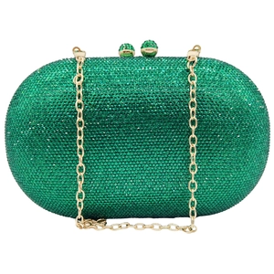 Detailed view of emerald green crystal clutch bag with gold chain and rhinestone clasp
