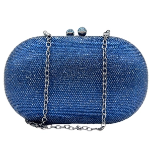 Detailed view of luxury blue rhinestone evening clutch with silver chain and metal clasp