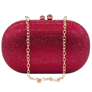 Elegant red crystal clutch bag with a gold chain strap and shimmering rhinestone finish