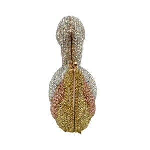 Detailed back view of a swan-shaped evening clutch bag with sparkling pink and white crystals