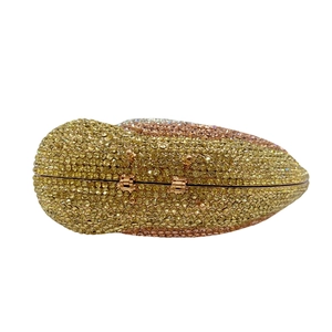 Detailed view of champagne gold crystal evening clutch with luxury diamond inlay