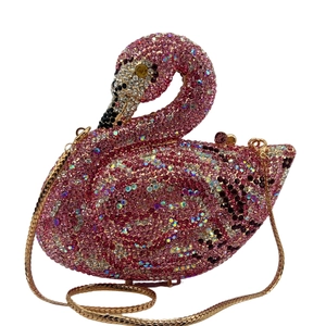 Macro shot of detailed pink crystal swan clutch with intricate rhinestone embellishments