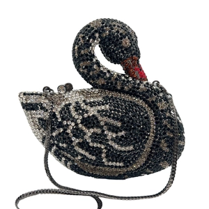 Close-up of sparkling swan evening clutch bag with intricate crystal rhinestones detail