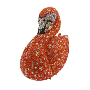 Macro shot of flamingo evening clutch bag fully embellished with orange crystal rhinestones