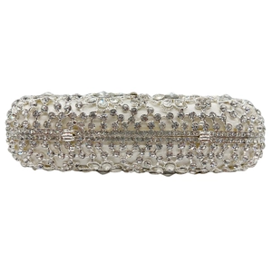 Elegant silver cylindrical clutch bag featuring full rhinestone inlay and metal hinge