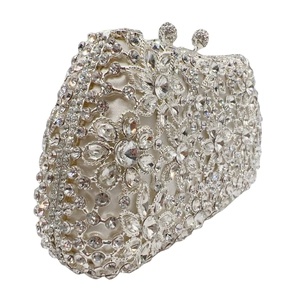 Macro view of crystal encrusted floral evening clutch with luxury sparkling rhinestones