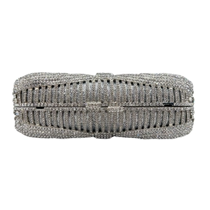 Detail of silver rhinestone evening clutch bag with sparkling diamond bow decoration