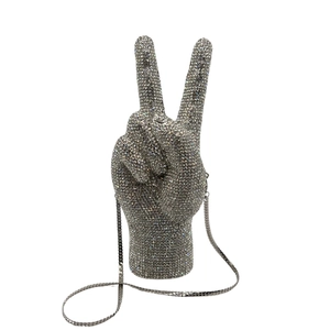 Macro shot of silver rhinestone victory hand gesture evening clutch bag details