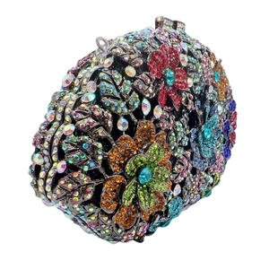 Macro view of crystal flower evening clutch with multi-colored rhinestones and metal clasp